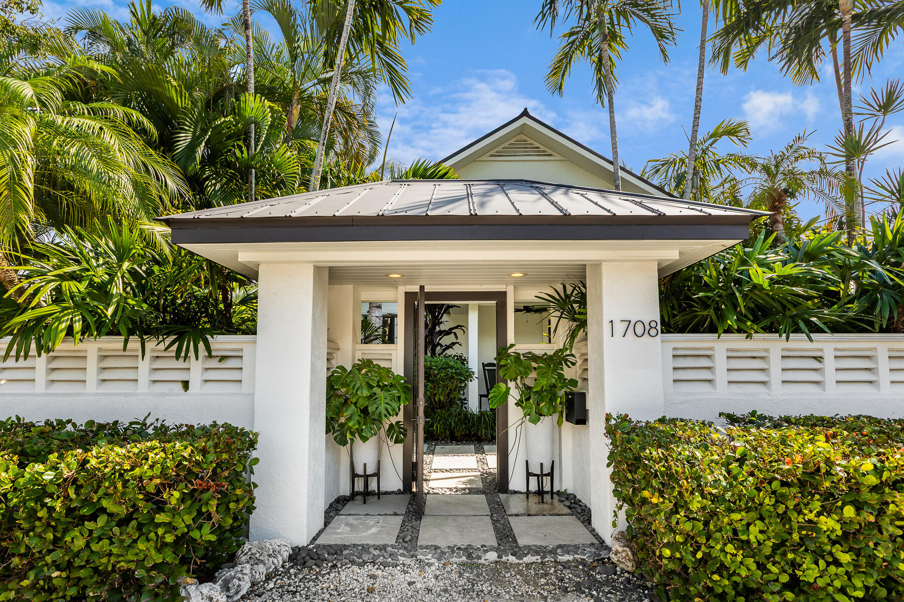 1708 Laird Street Key West, FL 33040 - Photo 8 of 43 a front view of a house with a garden