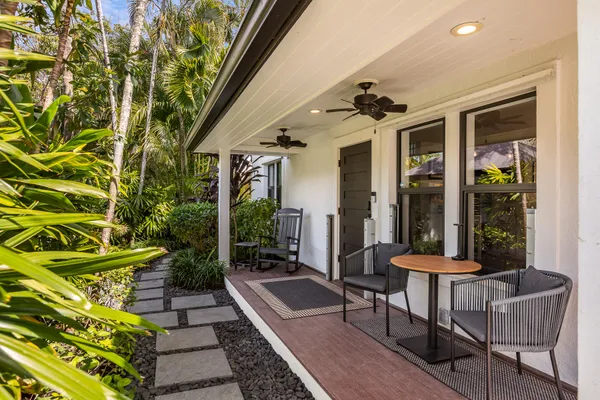a bedroom with a large bed and a large window