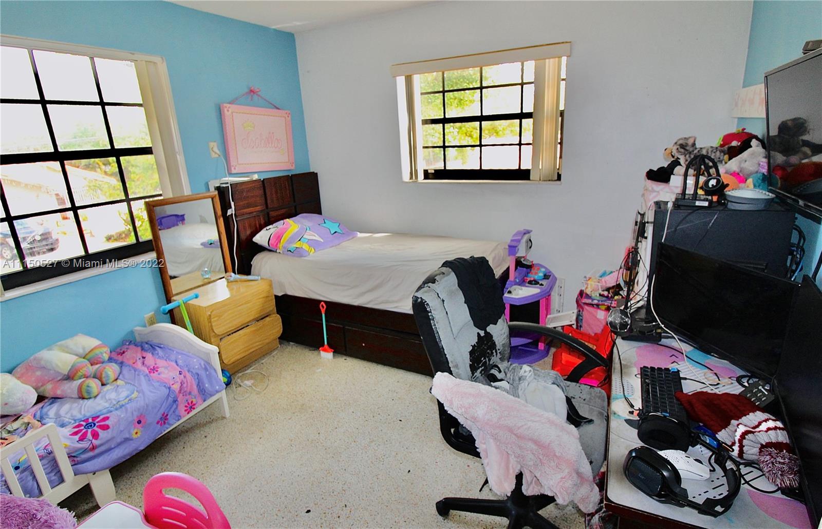 46 Northwest 35th Street Miami, FL 33127 - Photo 11 of 21 a room with toys and a wooden floor