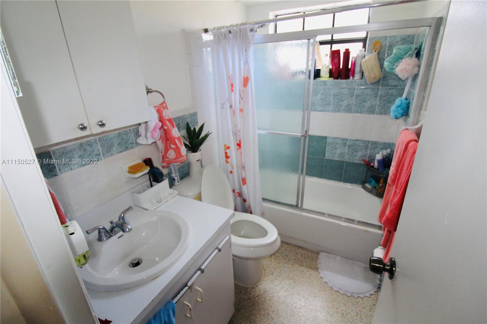 46 Northwest 35th Street Miami, FL 33127 - Photo 12 of 21 a bathroom with a sink toilet and shower