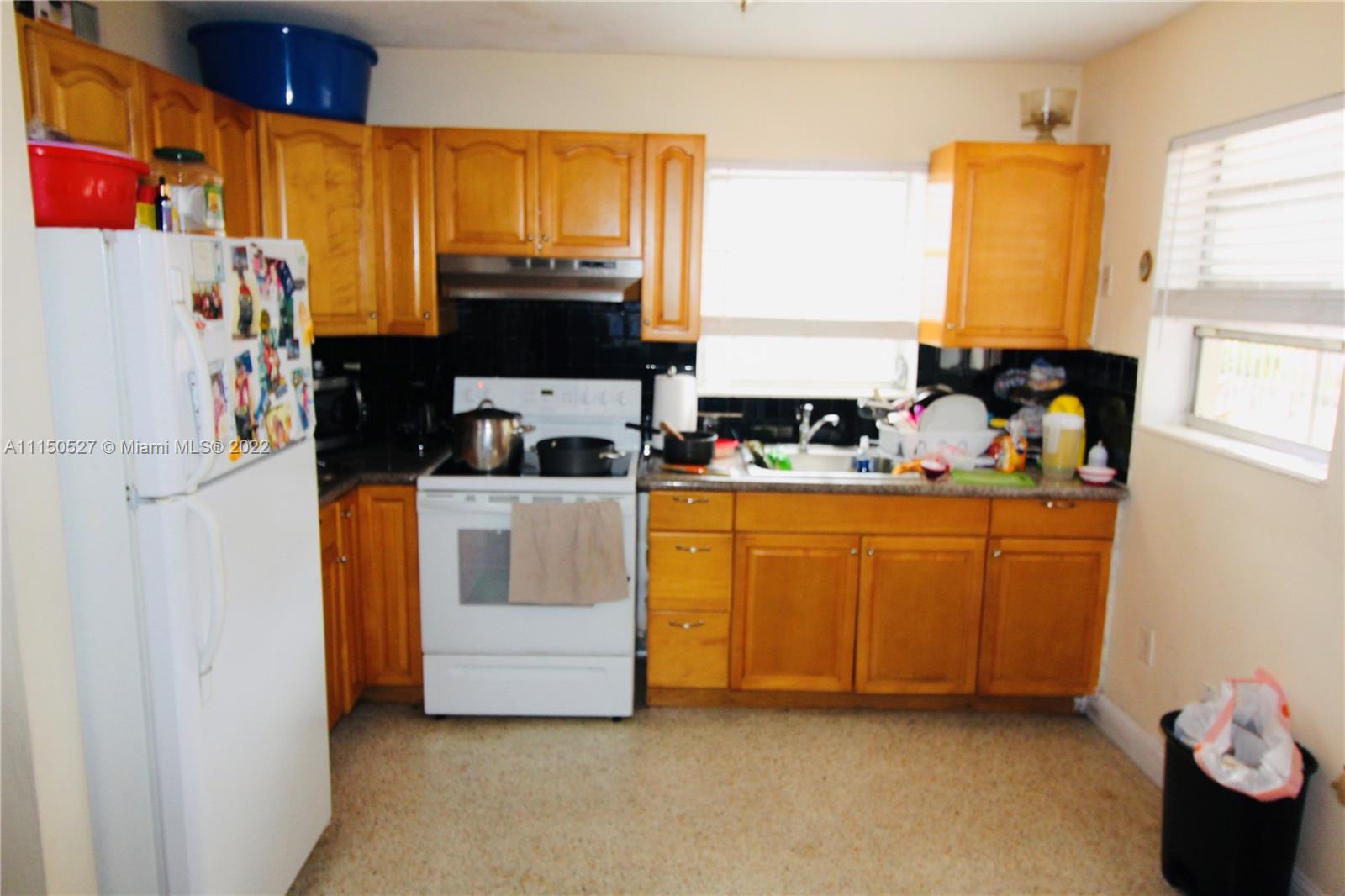 46 Northwest 35th Street Miami, FL 33127 - Photo 13 of 21 a room with cabinets and window