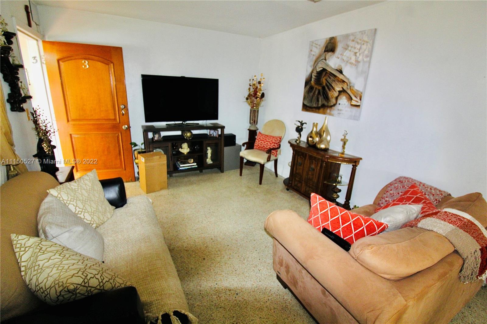 46 Northwest 35th Street Miami, FL 33127 - Photo 14 of 21 a living room with furniture and a flat screen tv
