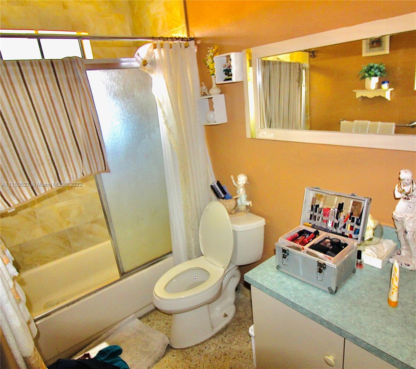 46 Northwest 35th Street Miami, FL 33127 - Photo 19 of 21 a bathroom with a sink and a mirror