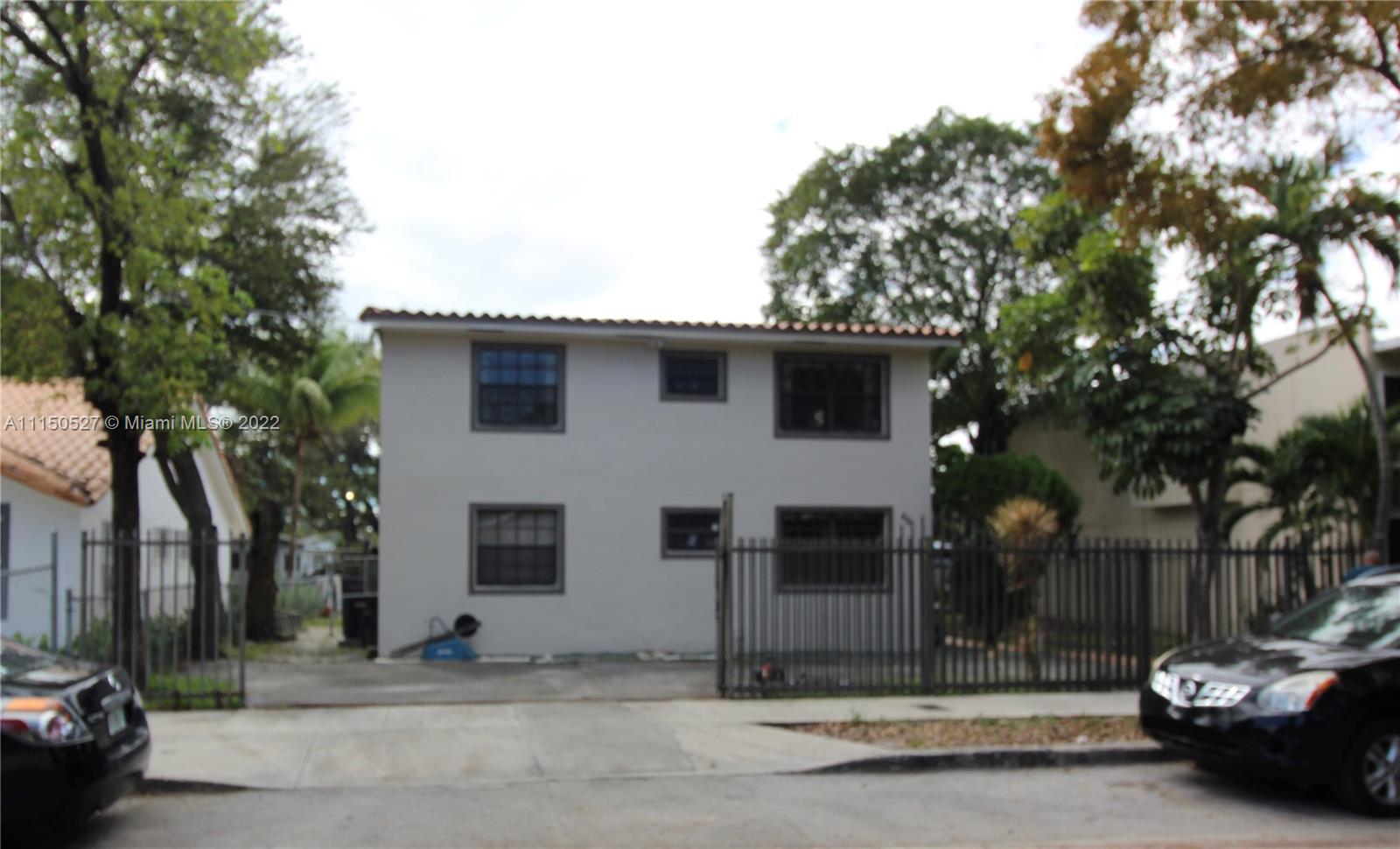 46 Northwest 35th Street Miami, FL 33127 - Photo 2 of 21 a front view of a house with a garden