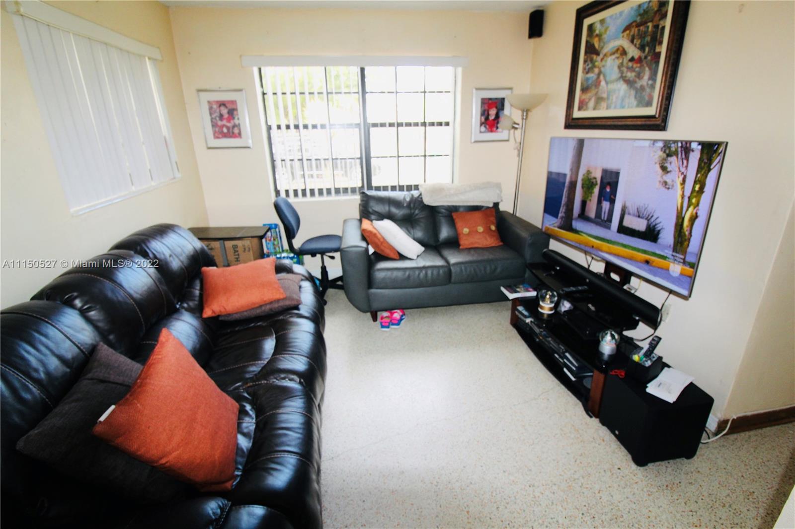 46 Northwest 35th Street Miami, FL 33127 - Photo 8 of 21 a living room with furniture rug and window