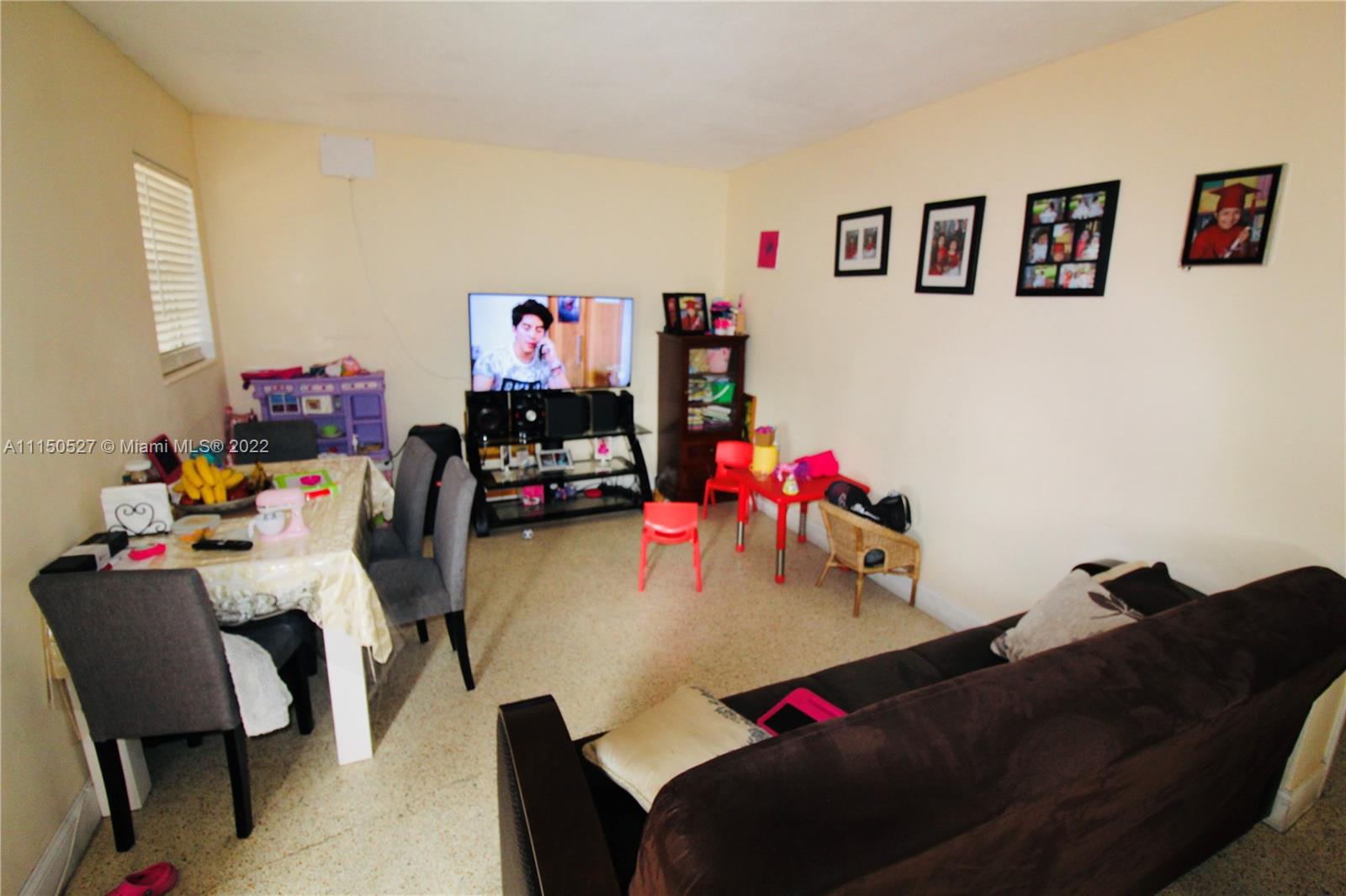 46 Northwest 35th Street Miami, FL 33127 - Photo 9 of 21 a living room with furniture and a couch