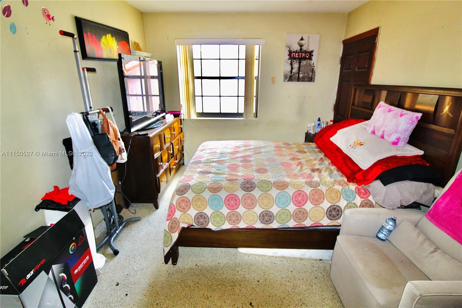 46 Northwest 35th Street Miami, FL 33127 - Photo 10 of 21 a bedroom with bed and a flat tv screen