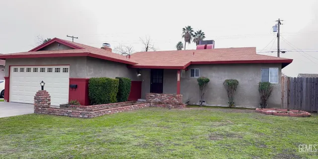 a view of a house with table and chairs