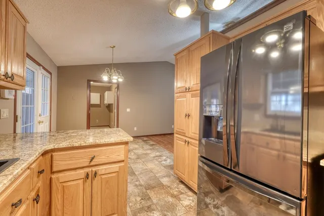 a bathroom with a granite countertop sink mirror and shower