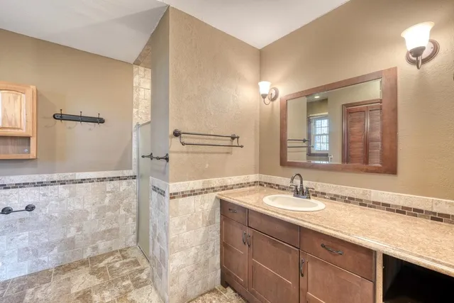 a bathroom with a sink and a mirror