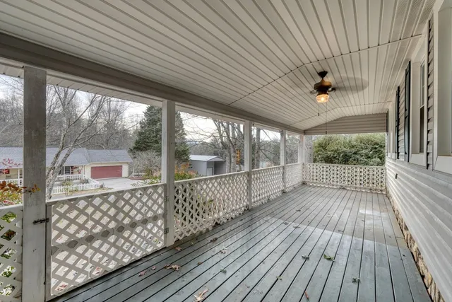 a view of a porch with wooden floor