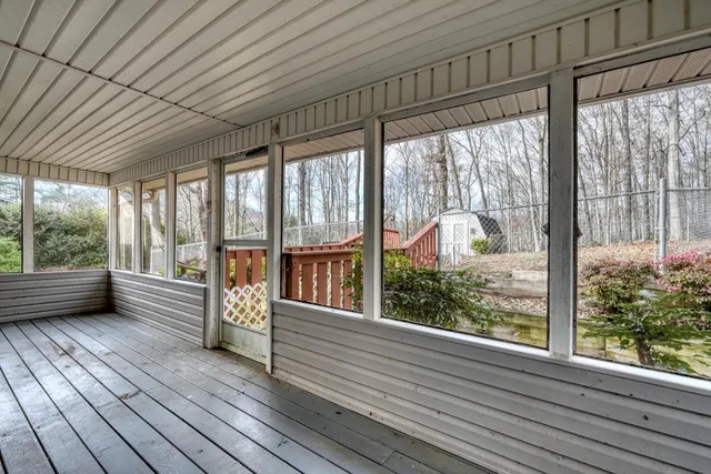 a view of a room with wooden floor and wooden floor