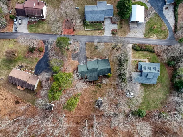 an aerial view of residential houses with outdoor space