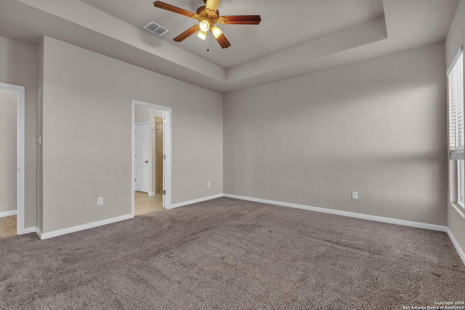 10411 Francisco Way Converse, TX 78109 - Photo 13 of 25 a view of an empty room with a fan