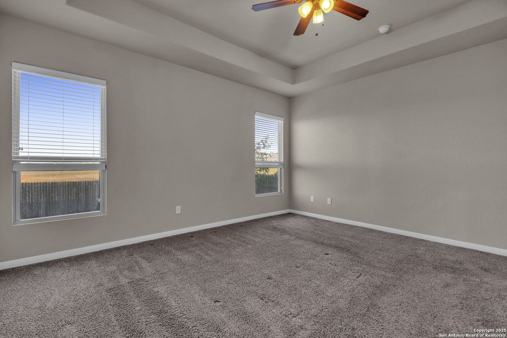 10411 Francisco Way Converse, TX 78109 - Photo 15 of 25 a view of an empty room with chandelier fan and window