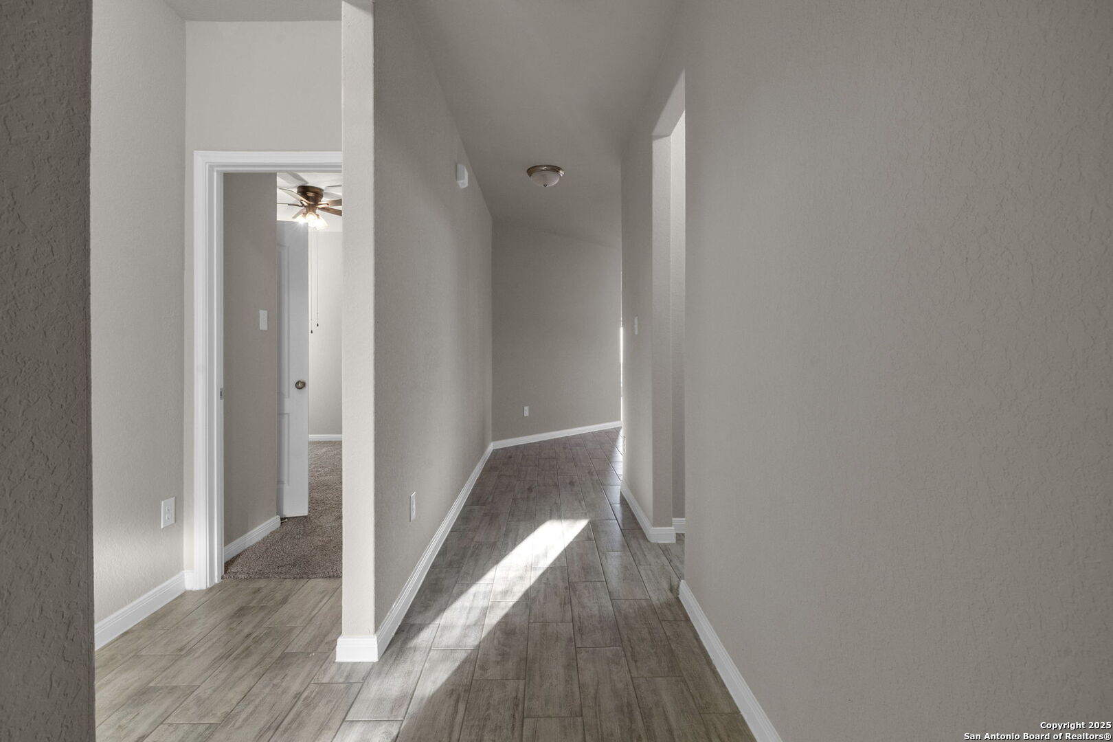10411 Francisco Way Converse, TX 78109 - Photo 15 of 25 a view of hallway with wooden floor