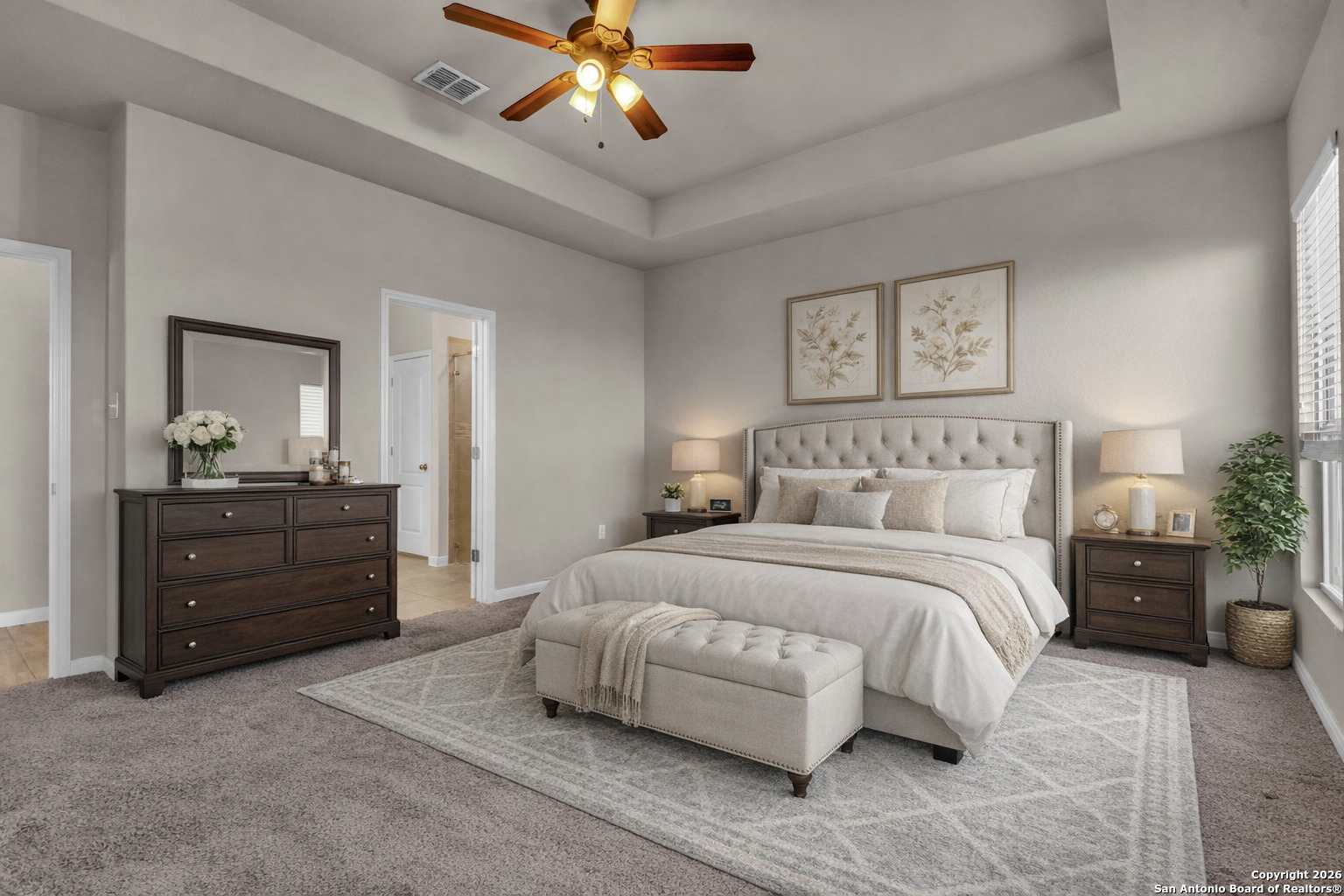 10411 Francisco Way Converse, TX 78109 - Photo 3 of 25 a bedroom with a bed and a chandelier