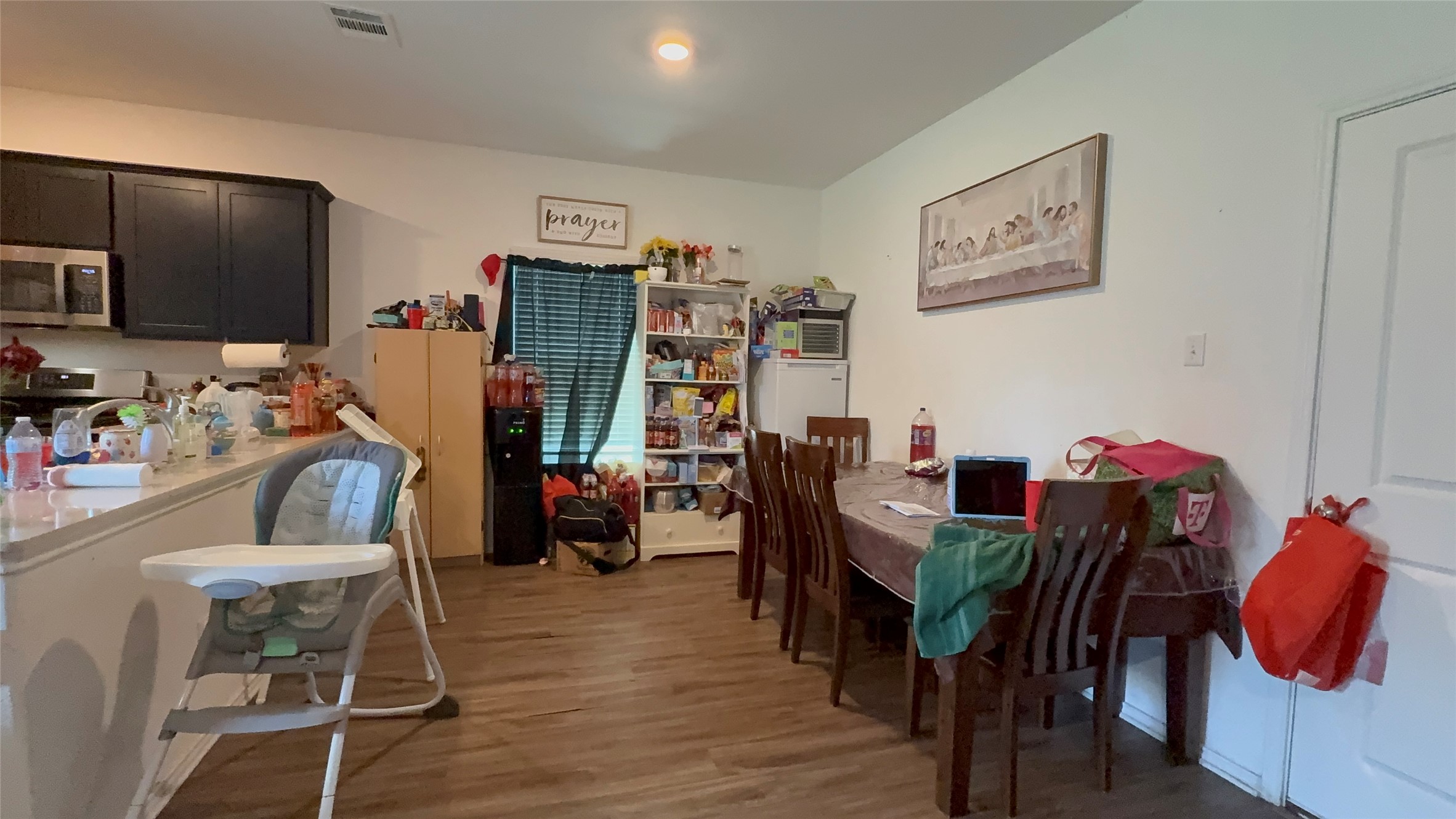 316 Geode Glen Maxwell, TX 78656 - Photo 10 of 24 a view of a dining room with furniture and wooden floor