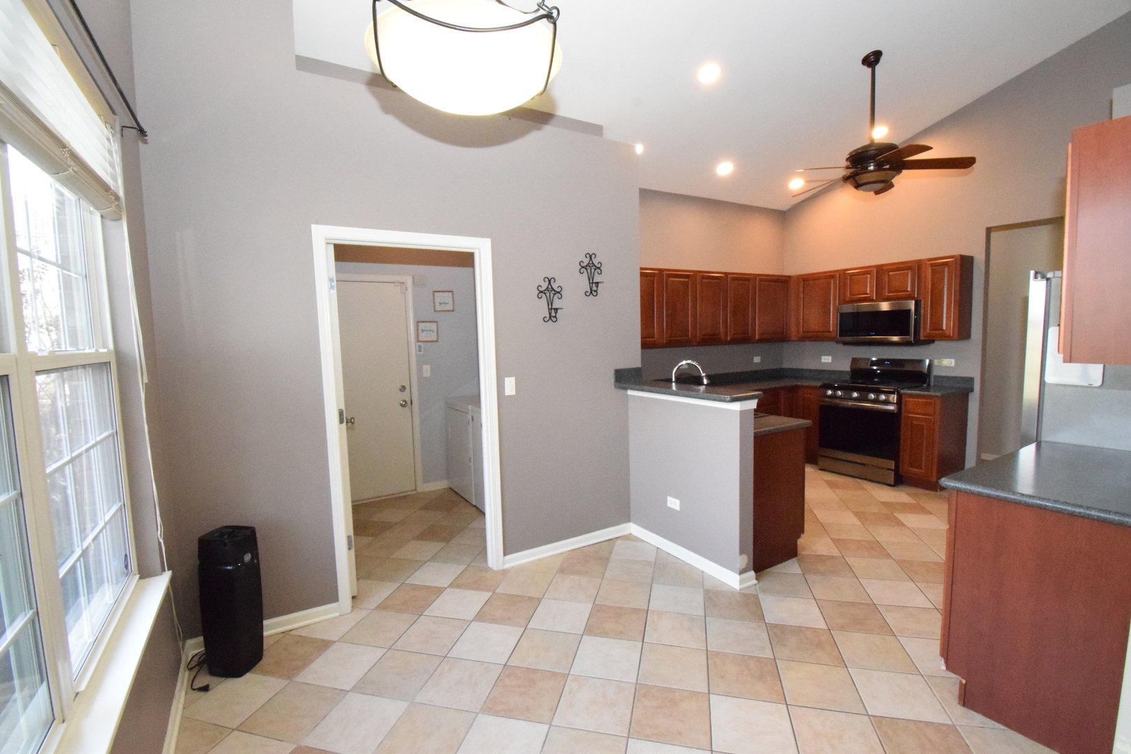 600 Countryfield Lane Elgin, IL 60120 - Photo 13 of 31 a kitchen with stainless steel appliances granite countertop a refrigerator a sink and a stove