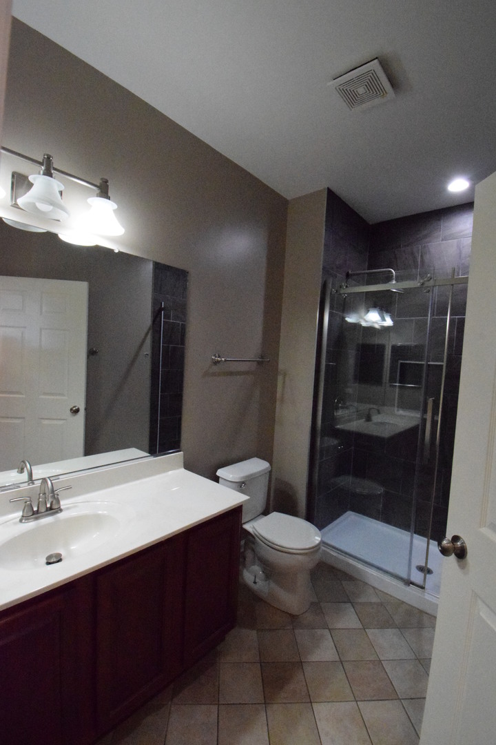 600 Countryfield Lane Elgin, IL 60120 - Photo 19 of 31 a bathroom with a sink toilet and shower