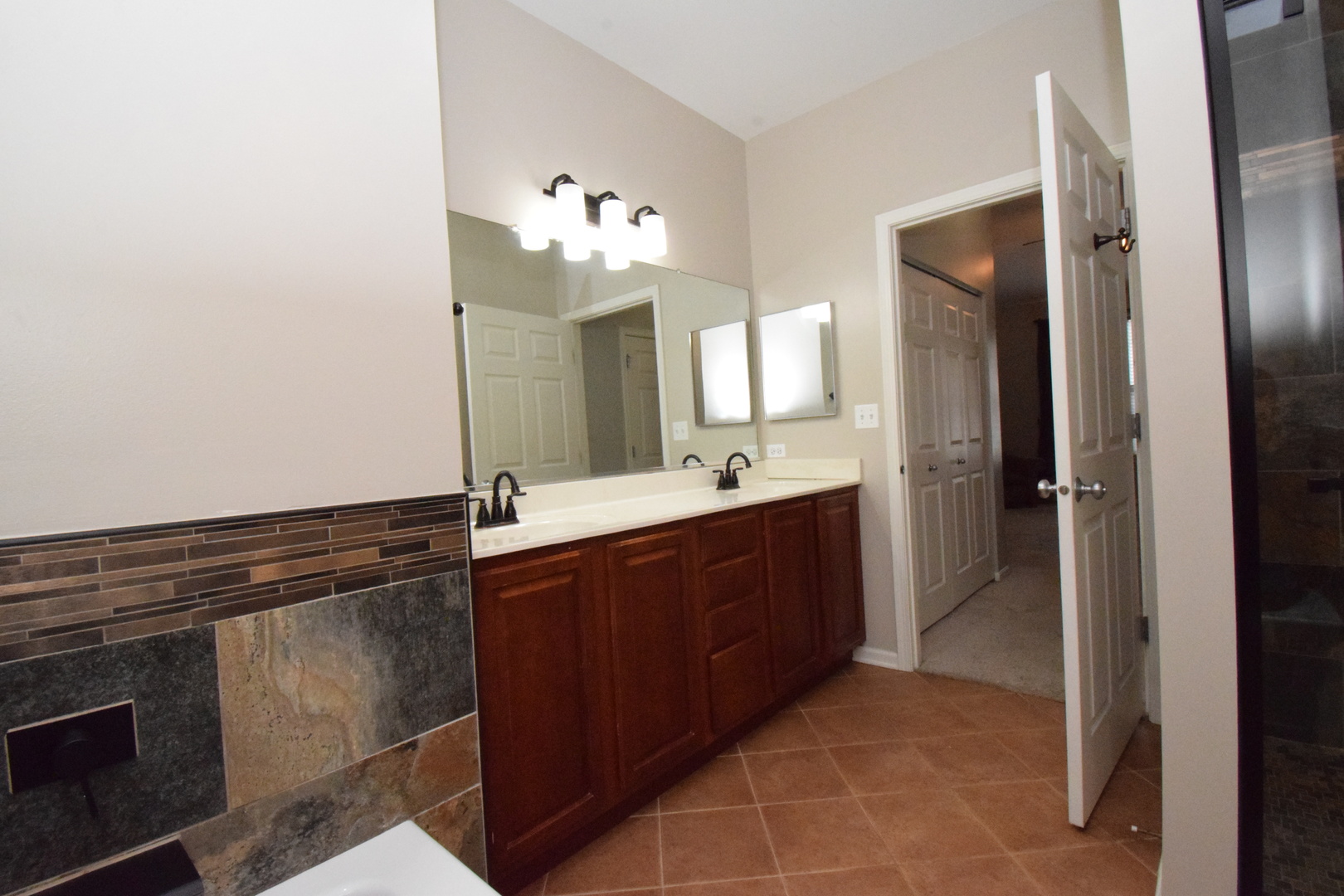 600 Countryfield Lane Elgin, IL 60120 - Photo 26 of 31 a spacious bathroom with a sink and a mirror