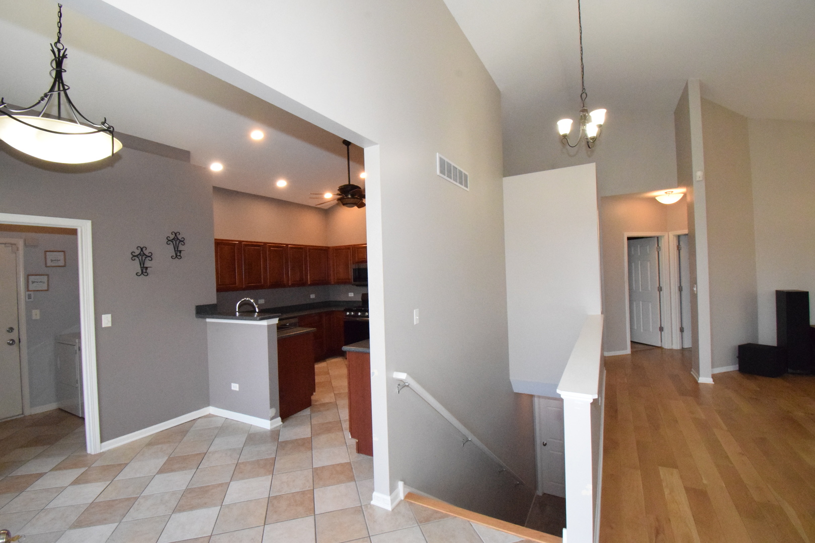 600 Countryfield Lane Elgin, IL 60120 - Photo 5 of 31 a view of a kitchen and a refrigerator a fireplace