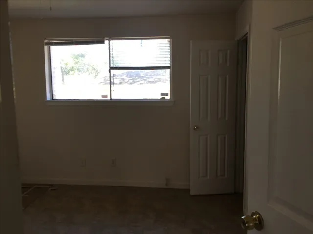 a view of a window in an empty room