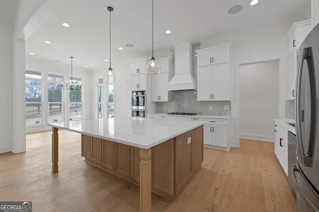 a view of a livingroom with a ceiling fan and window