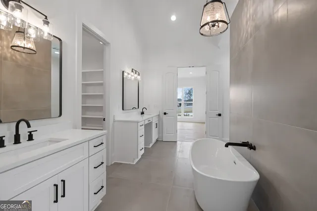 a bathroom with a double vanity sink mirror and double