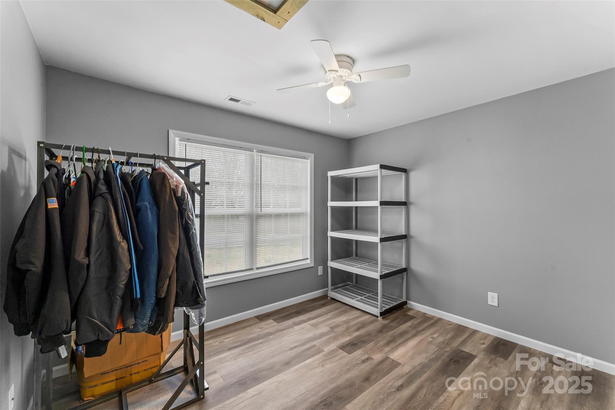 391 Springs East Road Lincolnton, NC 28092 - Photo 16 of 26 wooden floor in an empty room with a window