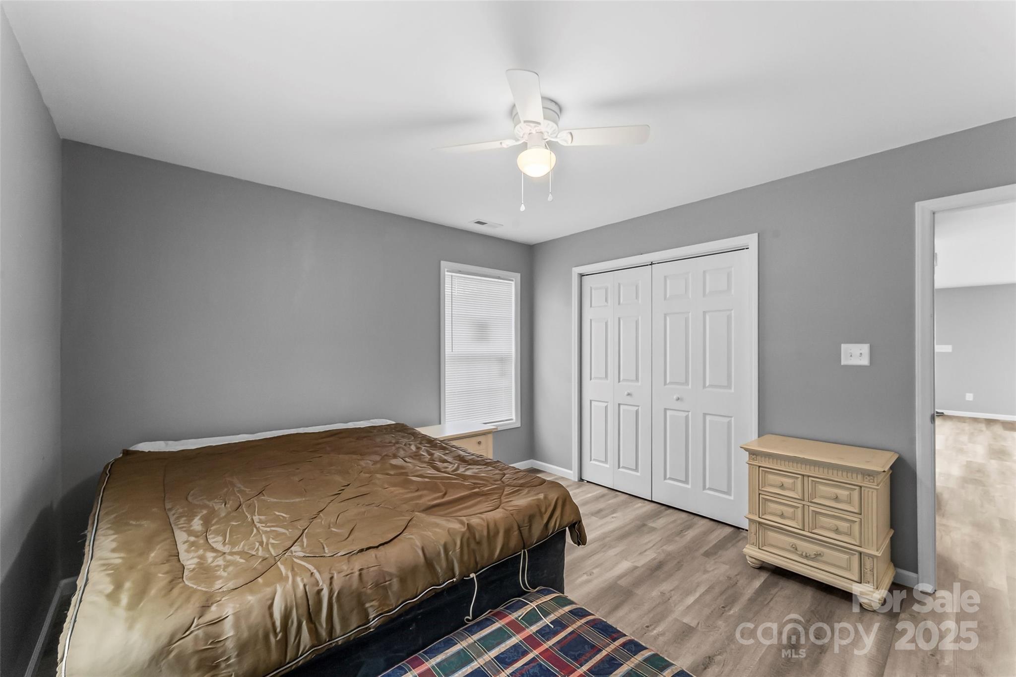391 Springs East Road Lincolnton, NC 28092 - Photo 18 of 26 a bedroom with a bed and wooden floor