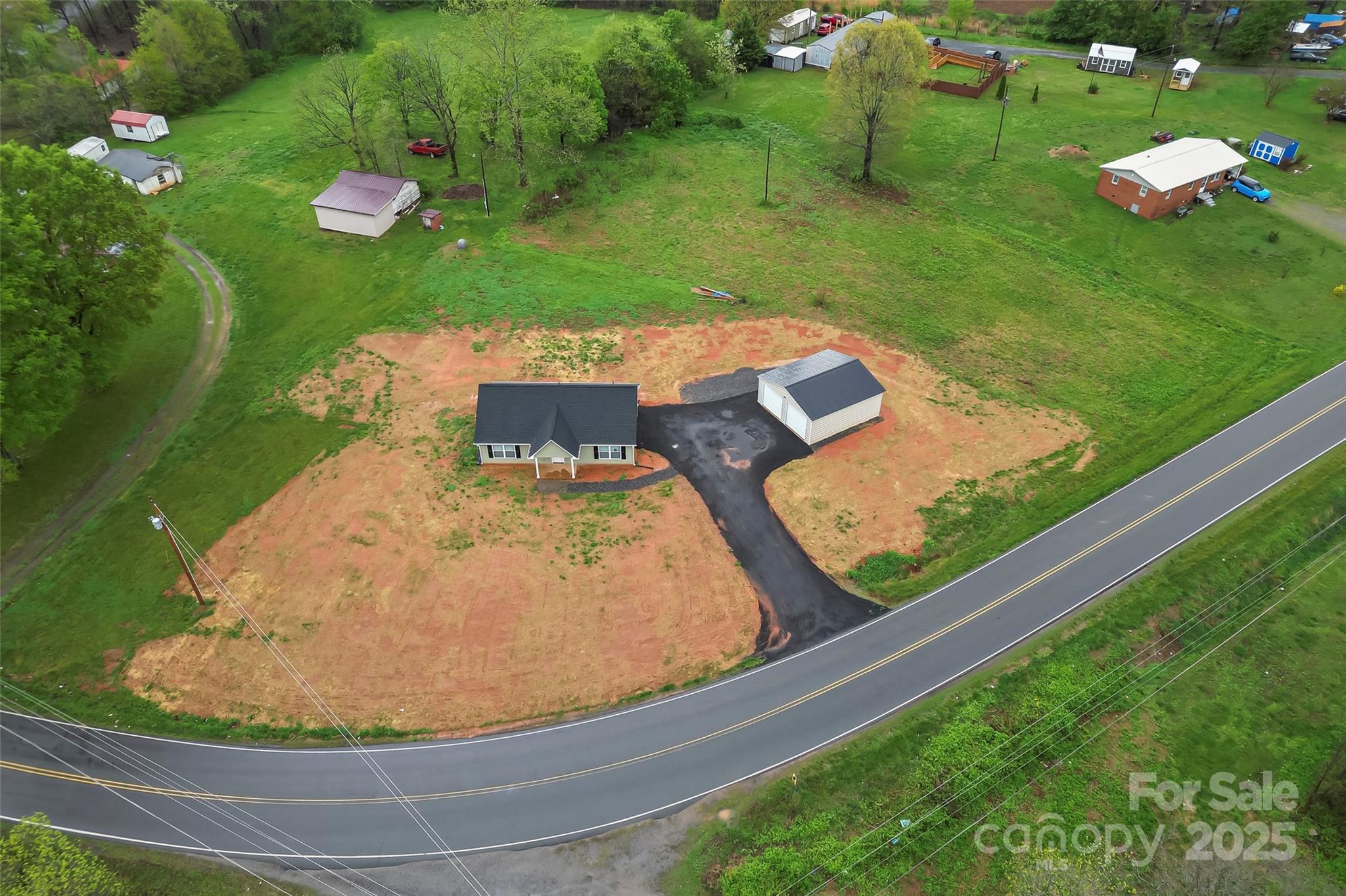 391 Springs East Road Lincolnton, NC 28092 - Photo 25 of 26 a view of a swimming pool with a yard and green space