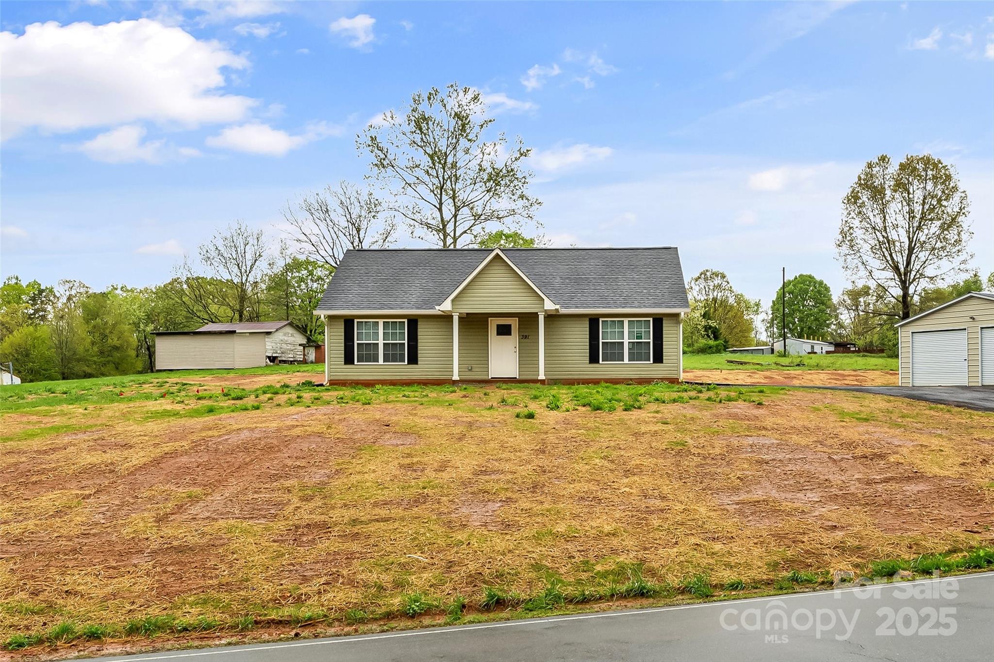 391 Springs East Road Lincolnton, NC 28092 - Photo 4 of 26 a house with garden in front of it