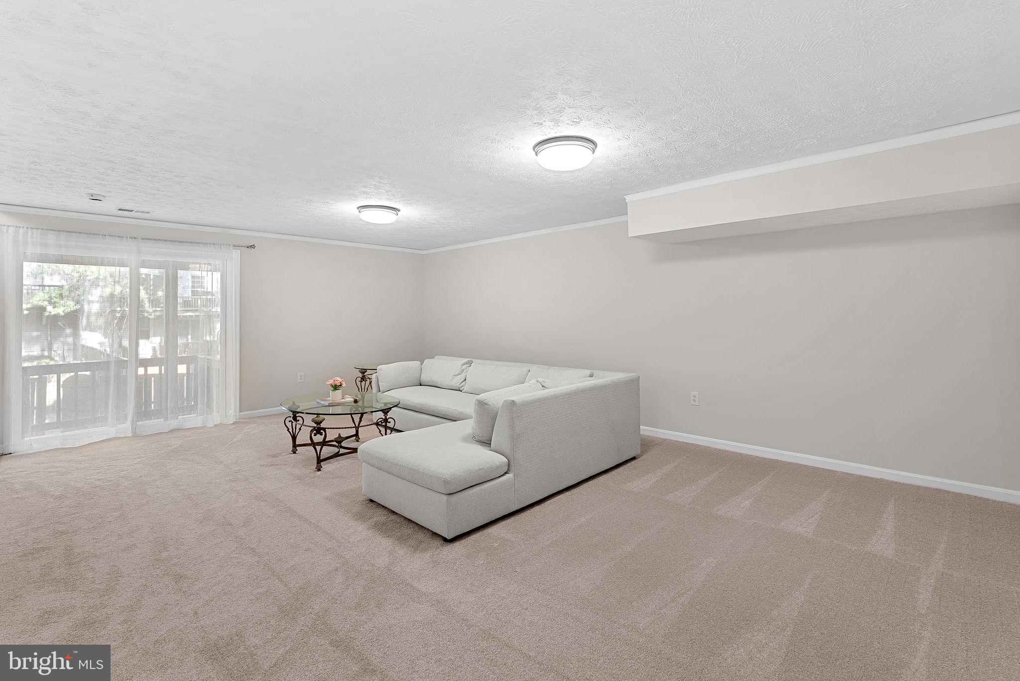 8228 Maple Ridge Avenue Springfield, VA 22153 - Photo 41 of 64 a living room with furniture and large windows