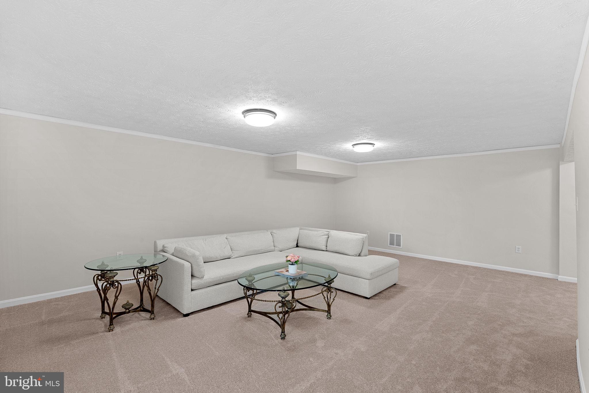 8228 Maple Ridge Avenue Springfield, VA 22153 - Photo 42 of 64 a living room with furniture and a couch