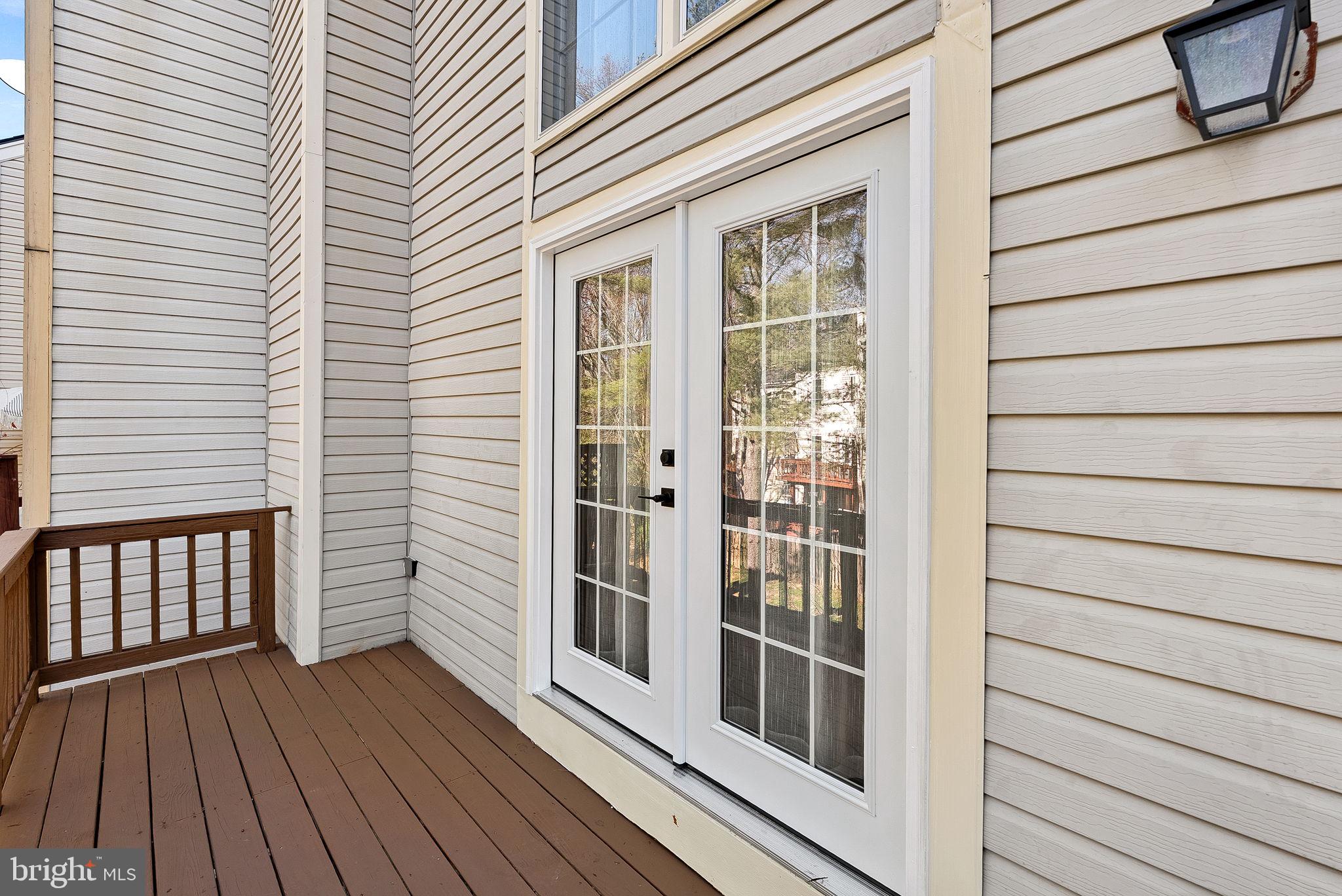 8228 Maple Ridge Avenue Springfield, VA 22153 - Photo 49 of 64 a view of front door and deck of the house