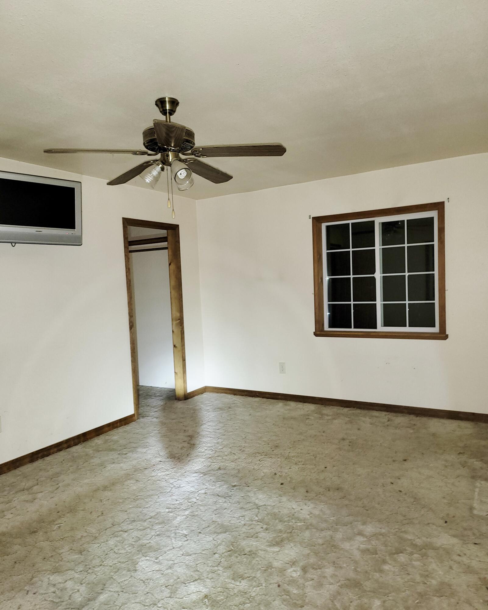 44961 Pine Shadows Road McArthur, CA 96056 - Photo 21 of 25 a view of a livingroom with a ceiling fan and wooden floor