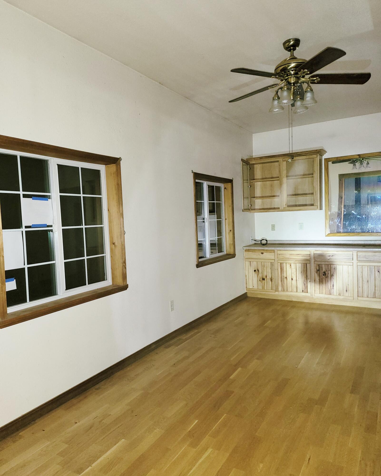 44961 Pine Shadows Road McArthur, CA 96056 - Photo 6 of 25 a view of an empty room with a window and kitchen view