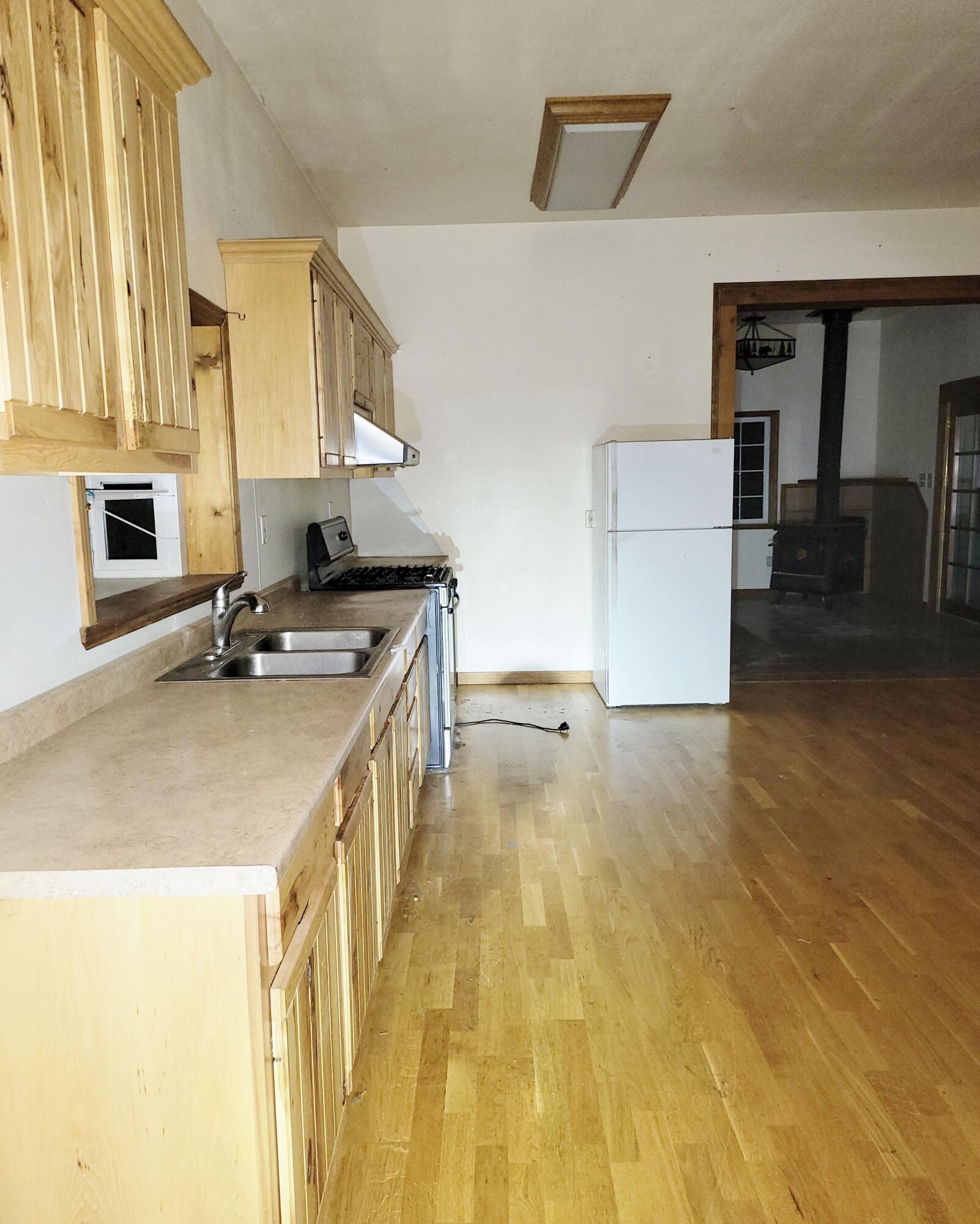 44961 Pine Shadows Road McArthur, CA 96056 - Photo 10 of 25 a kitchen with a sink appliances and cabinets