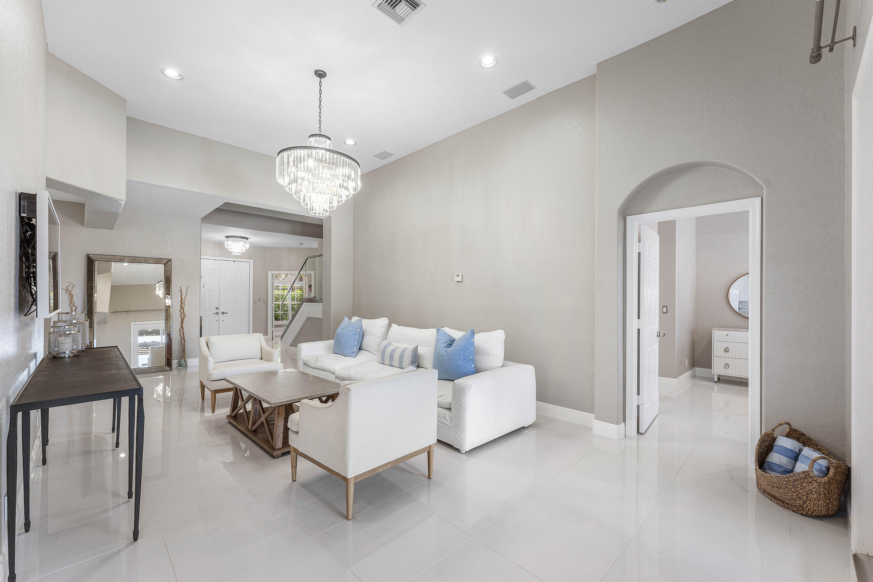 121 Palm Circle Lake Worth, FL 33462 - Photo 17 of 63 a living room with furniture and a chandelier