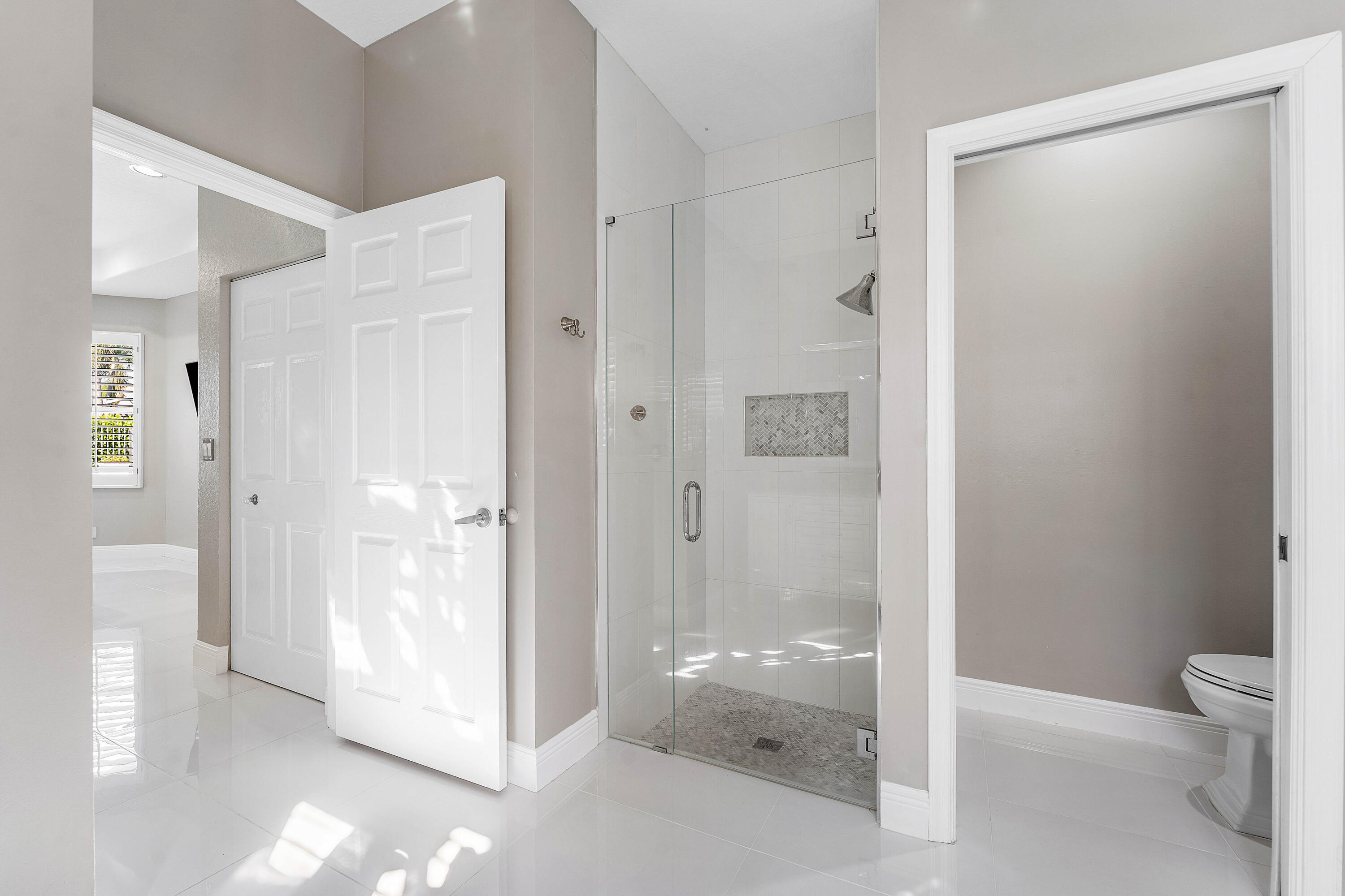 121 Palm Circle Lake Worth, FL 33462 - Photo 24 of 63 a bathroom with a shower and a toilet