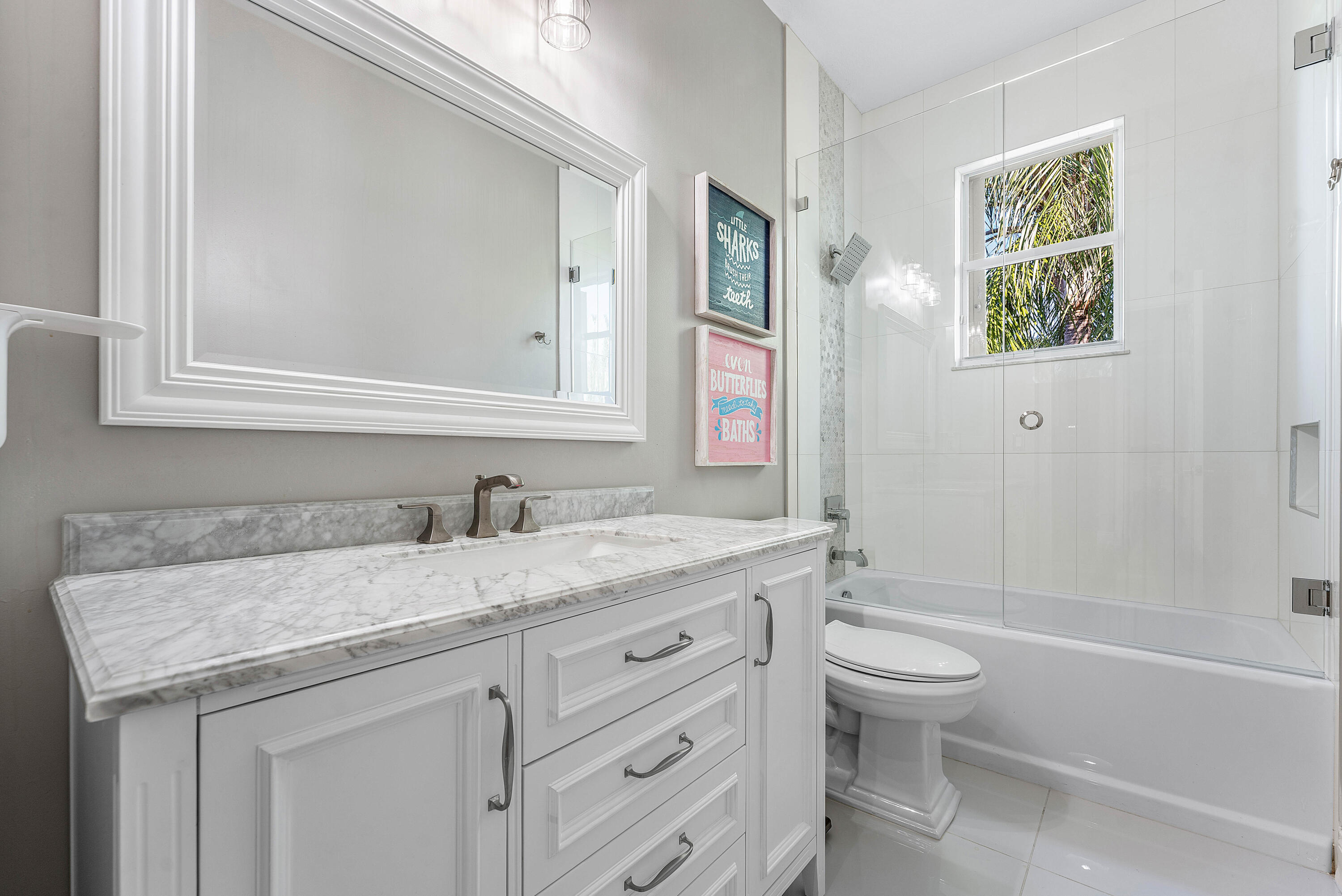 121 Palm Circle Lake Worth, FL 33462 - Photo 29 of 63 a bathroom with a granite countertop toilet sink and mirror