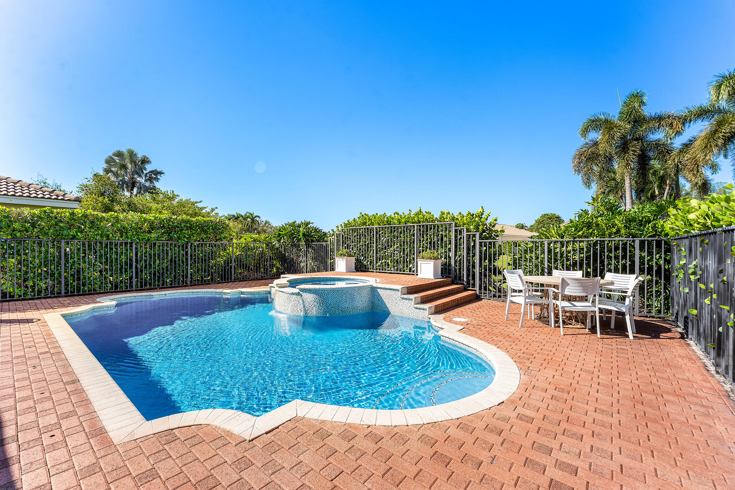 121 Palm Circle Lake Worth, FL 33462 - Photo 40 of 63 a view of a swimming pool with a patio