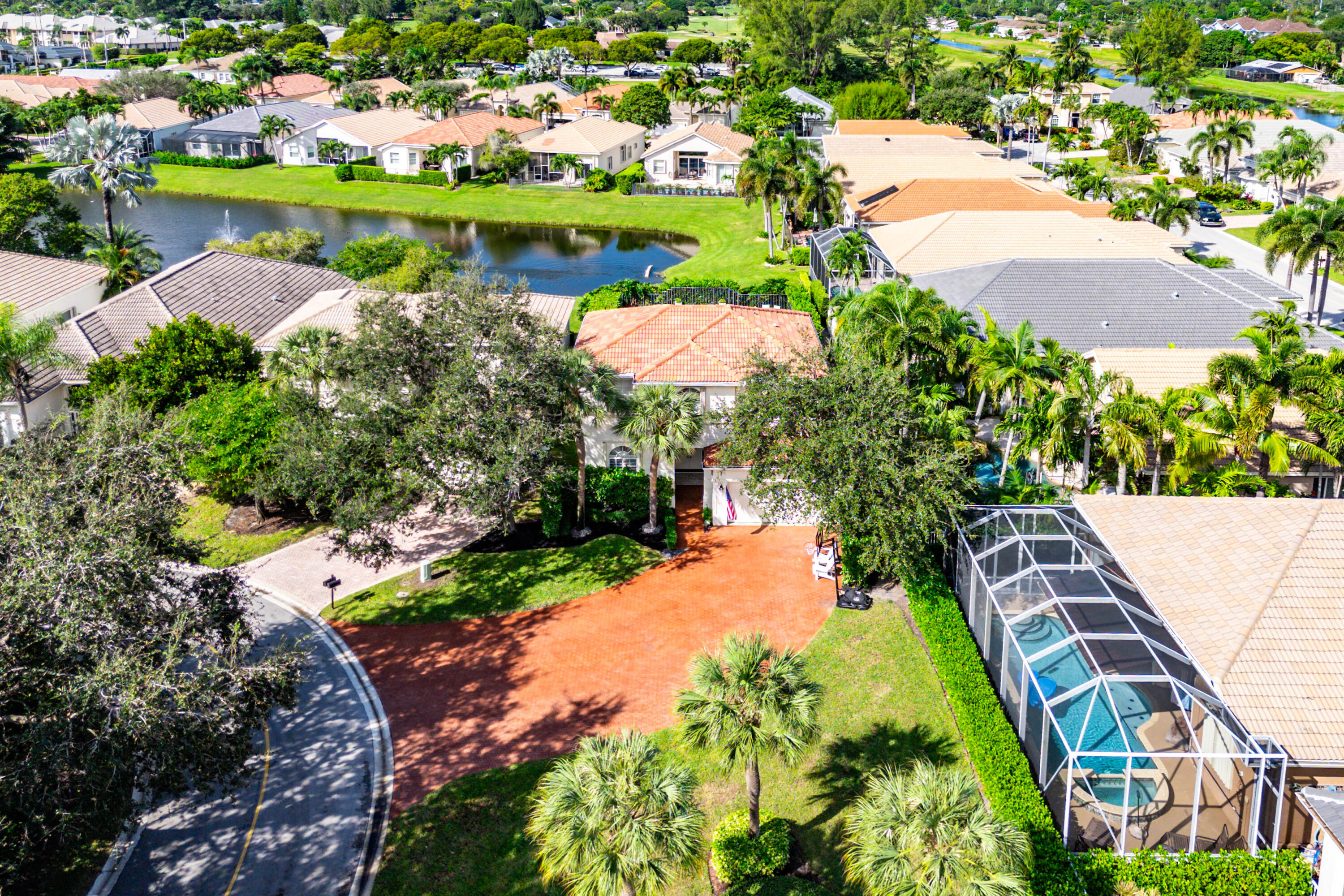 121 Palm Circle Lake Worth, FL 33462 - Photo 50 of 63 an aerial view of a house with a lake view