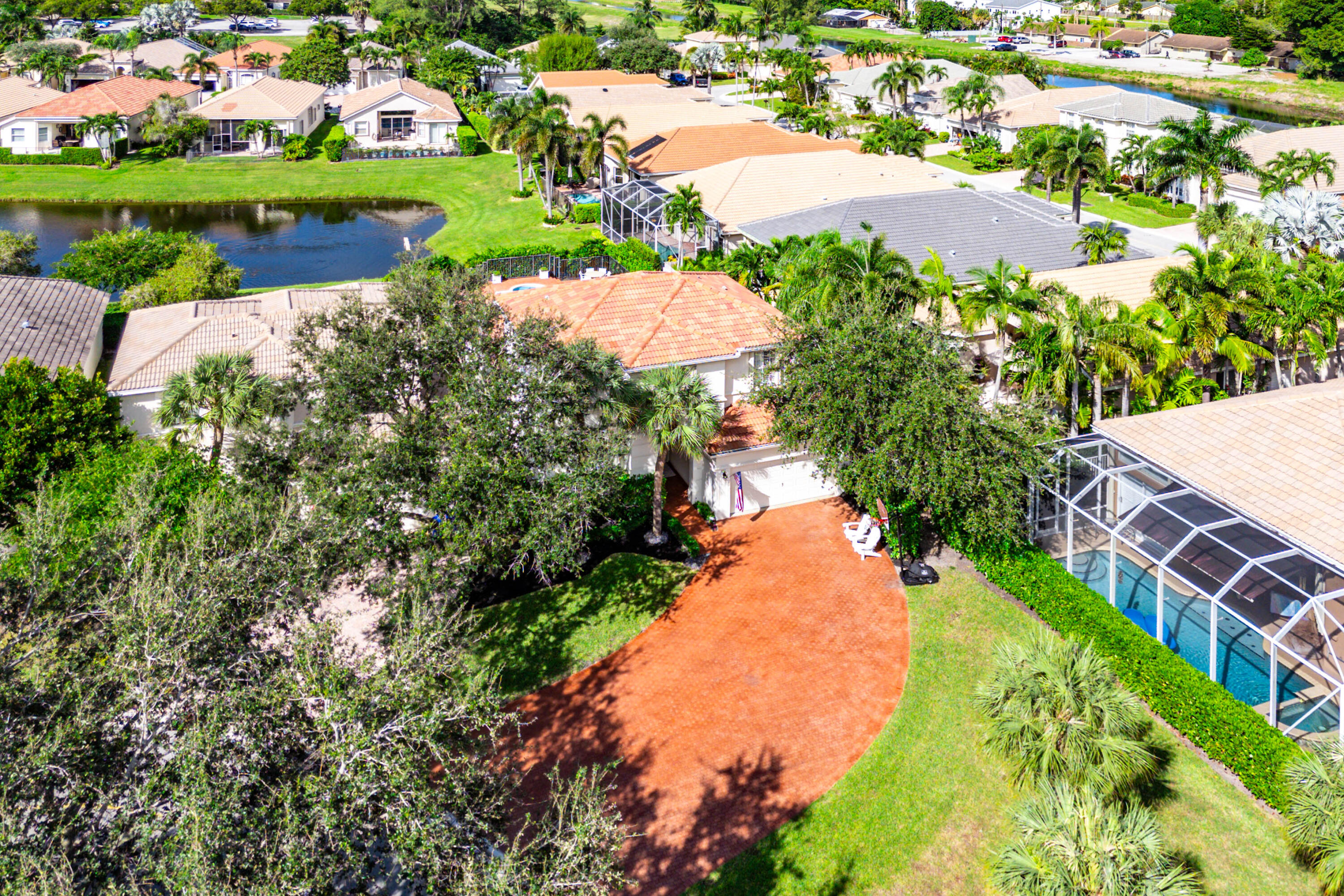 121 Palm Circle Lake Worth, FL 33462 - Photo 51 of 63 a view of a lake with a yard and lake view