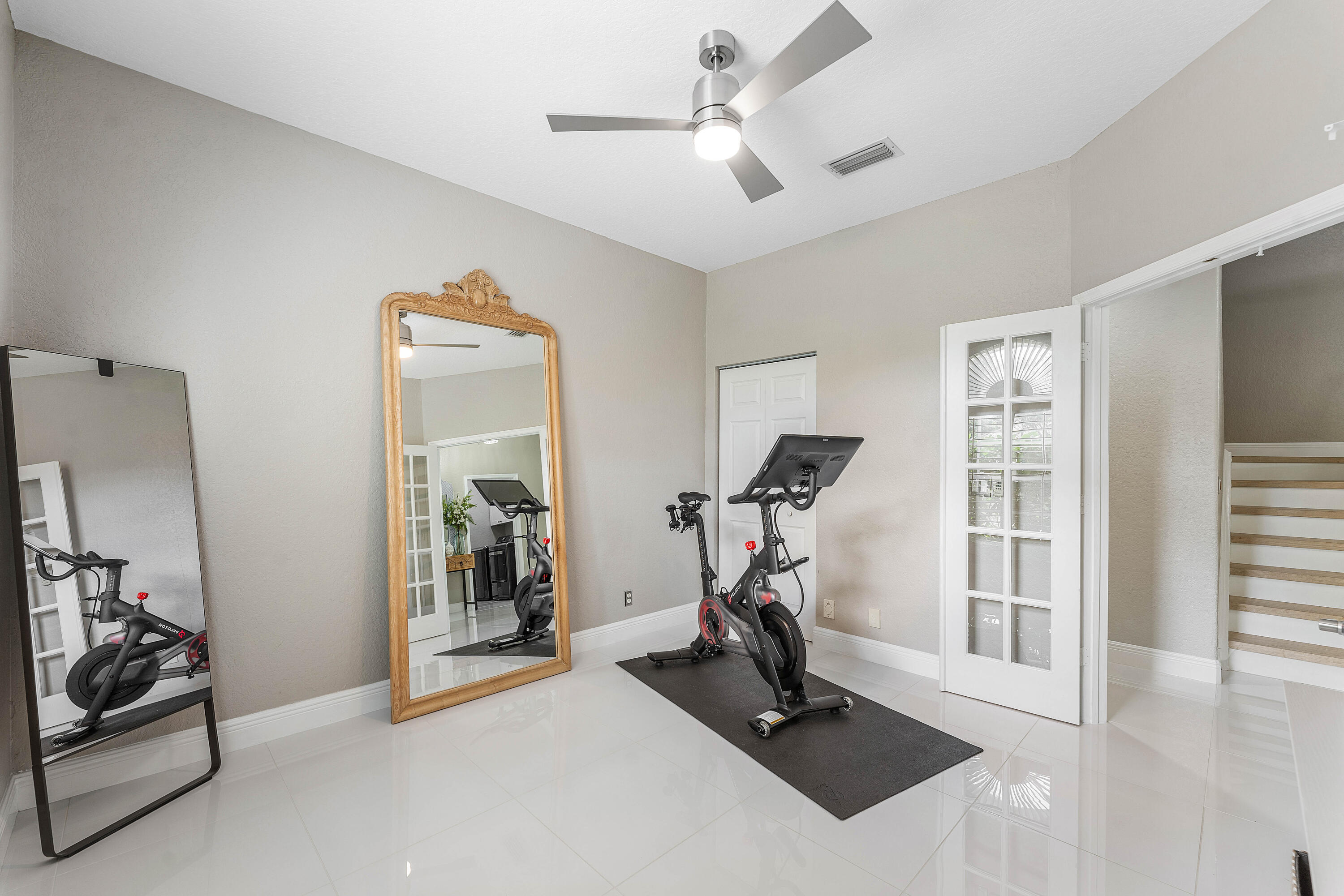 121 Palm Circle Lake Worth, FL 33462 - Photo 8 of 63 a view of a room with gym equipment