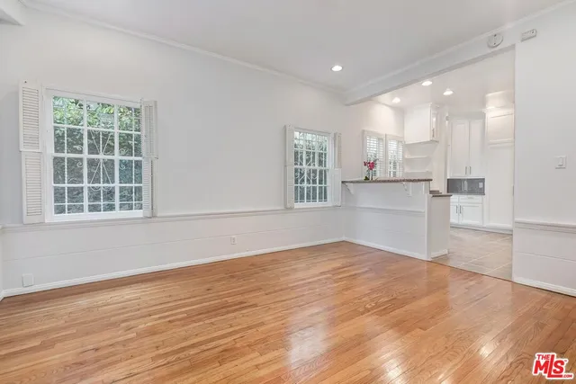 a view of kitchen with wooden floor and windows