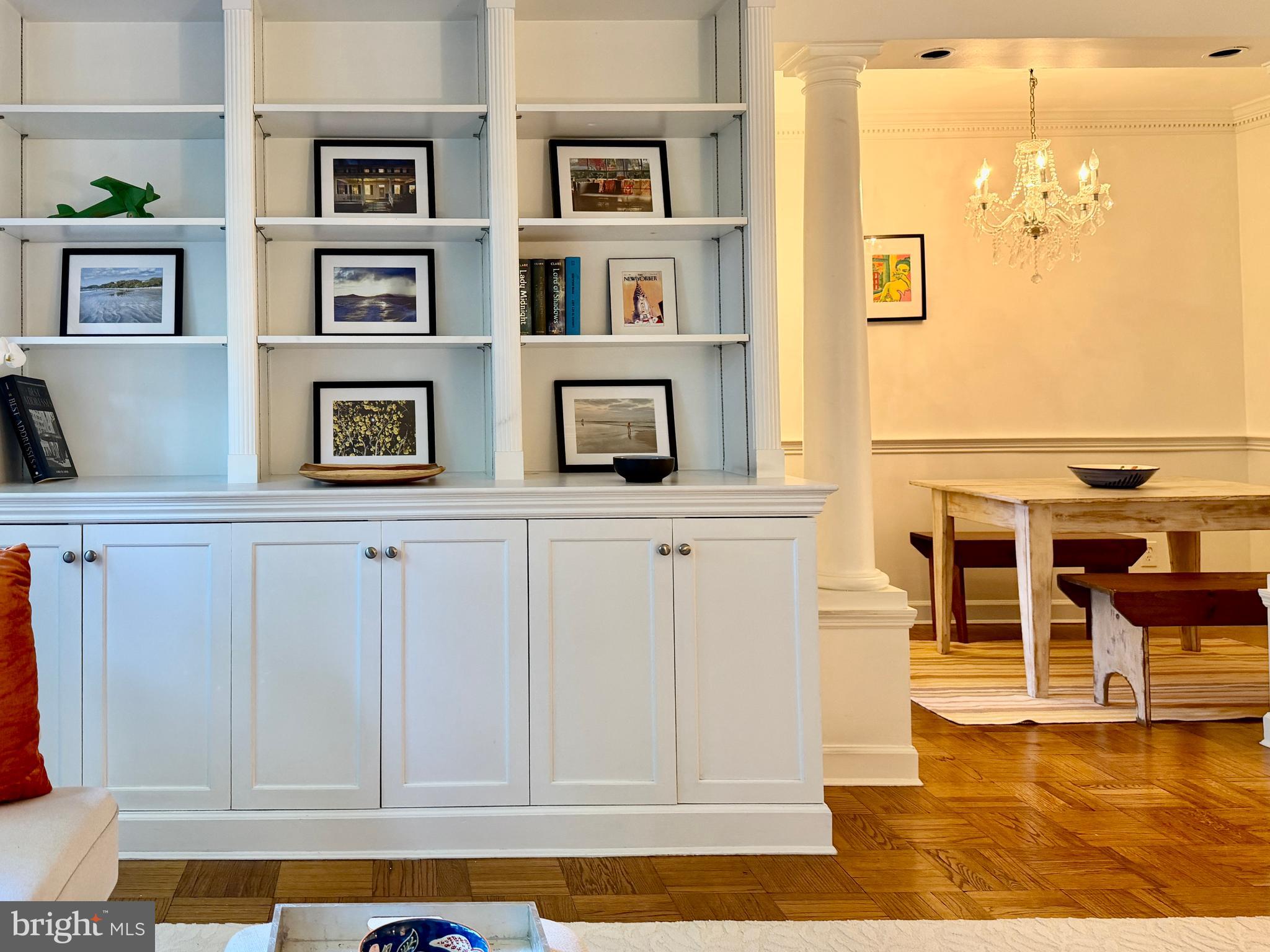 2500 Q Street Northwest, Unit 307 Washington, DC 20007 - Photo 8 of 17 a kitchen with white cabinets and wooden floor