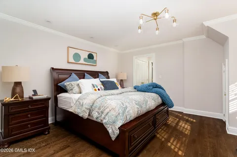 a bed room with a bed and a night stand