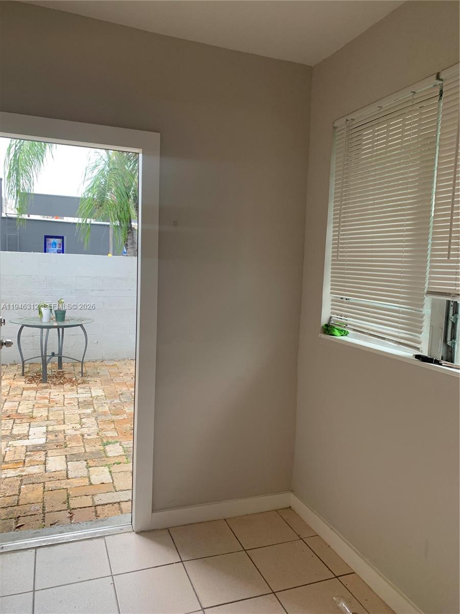 821 Southwest 29th Court, Unit 3 Miami, FL 33135 - Photo 3 of 10 a view of an empty room with a window